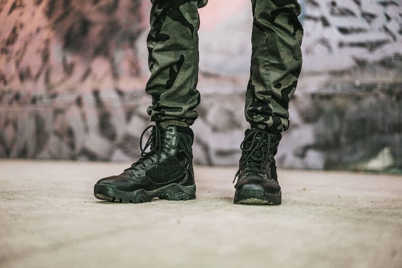 man wearing military boots for an airsoft game